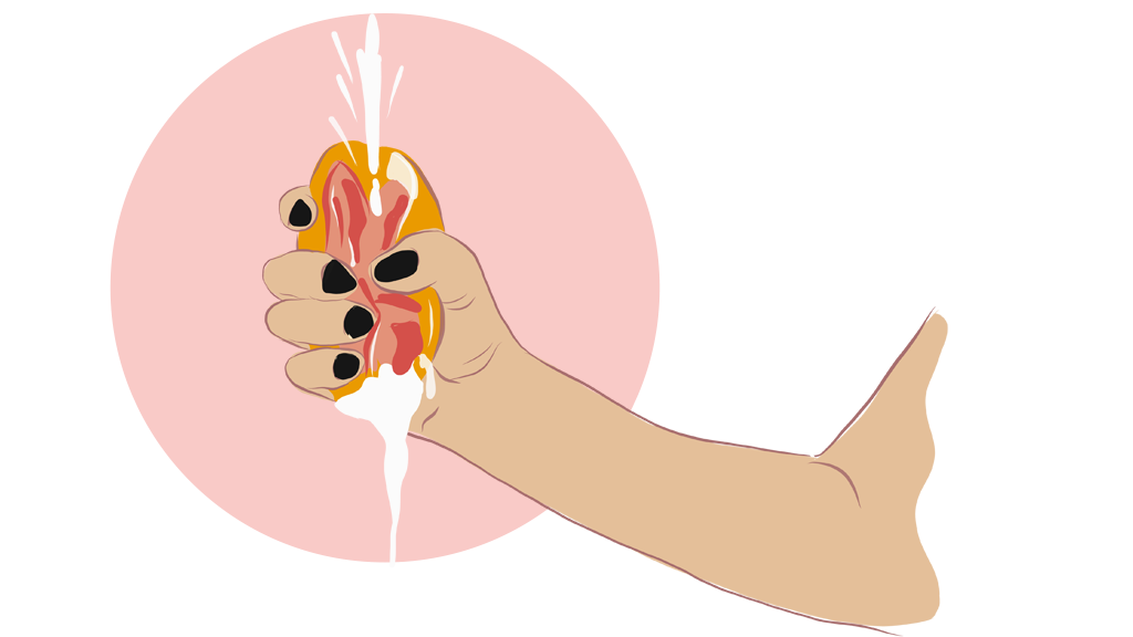 A hand squeezing a grapefruit.